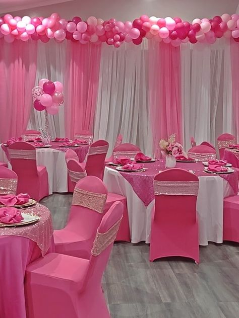 Amp up your girl baby shower party ambiance by decorating the whole space with pink and white decorations. Hang white & pink curtains on a backdrop stand and add a lovely bunch of pink and white balloons to elevate their elegance. Dress up the party tables in white tablecloths and pink sequin overlays and chairs in pink covers and pink sequin sashes. Arrange pink chargers with pink napkins placed atop and display a lovely flower and balloon centerpiece to give your tabletops a glamorous appeal. Pink Tablescape Party Tables, Shades Of Pink Theme Party, Shades Of Pink Birthday Party Decorations, Shades Of Pink Decorations Party, Barbie Themed Baby Shower Pink, Shades Of Pink Baby Shower Ideas, Shades Of Pink Party Decorations, Pink And White Party Decorations, 13 Shades Of Pink Party