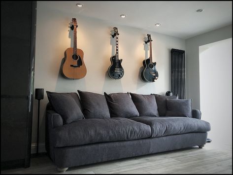 Guitars Hanging On Wall, Guitar Feature Wall, Hanging Guitars, Guitar Display, Guitar Wall, Diy Balloon Decorations, Spot Lights, Bohemian Bedroom Decor, Work Spaces