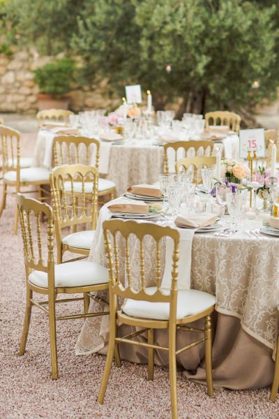 Gilded wedding tables: http://www.stylemepretty.com/2014/11/14/summer-chateau-south-of-france-wedding/ | Photography: Marianne Taylor - http://www.mariannetaylorphotography.co.uk/ Champagne Satin Tablecloth Wedding, Gilded Wedding, French Chateau Wedding Ceremony, Wedding Venue South Of France, Wedding In France French Chateau, Garden Party Recipes, Wedding Reception Chairs, Chateau De Villette Wedding, Reception Chairs