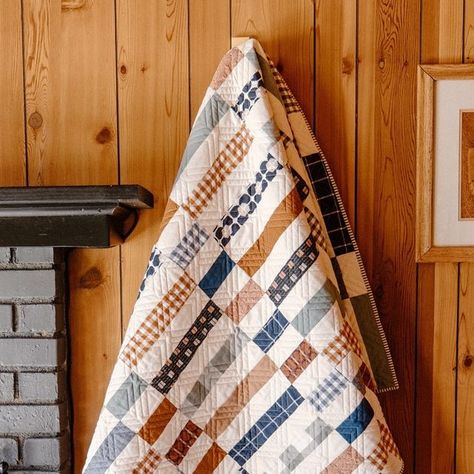 Alexis || Stitched By Alexis on Instagram: "✨ Welcome to Day 1 of the Quilty Cabin Series! ✨
⠀⠀⠀⠀⠀⠀⠀⠀⠀
This October, I’ll take you on a tour of the gorgeous @whiskeycreekcabin , sharing 7 personal quilts that will set the perfect mood for your fall and holiday season. 🎄🧑‍🎄
⠀⠀⠀⠀⠀⠀⠀⠀⠀
First up is Madeline! This quilt features a curated bundle from @peonypedalquilts , blending deep blues and rich browns for a beautifully masculine design. Perfection! 👌
⠀⠀⠀⠀⠀⠀⠀⠀⠀
P.S. That panto is my new favorite! 🥰 Be sure to select “Diagonal Plaid 5” for your next Longarm quilt order!
_________________

Quilt Maker: Alexis of @stitchedbyalexis 
Quilt Pattern: #Madelinequilt by @penelopehandmade 
Fabric bundle: @peonypedalquilts and @konacotton in Natural 
Batting: Double bamboo from @quiltersdream 
Pan Blue Couch, Blue Couches, Masculine Design, Fabric Bundle, Quilt Pattern, Deep Blue, Quilt Patterns, Holiday Season, Pattern