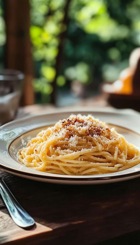 Indulge in the creamy, savory goodness of Cheesy Spaghetti Carbonara! This classic Italian dish features al dente spaghetti coated in a rich sauce made from eggs, Parmesan cheese, crispy bacon, and a hint of garlic. The cheese melts beautifully into the sauce, creating a luxurious texture that’s both comforting and flavorful. Carbonara With Pancetta, Cheesy Spaghetti, Classic Italian Dishes, Spaghetti Carbonara, Delicious Pasta, Pasta Dish, Crispy Bacon, Classic Italian, The Sauce