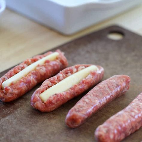 string cheese stuffed sausages getting cut open and cheese inserted before cooking Cheese Stuffed Bratwurst, Sausage With Cheese Stick, Italian Sausage With Cheese Sticks, Stuffed Bratwurst, Cheese Stuffed Italian Sausage, Cheese Stuffed Sausage, String Cheese Recipes, Sausage Ideas, Italian Sausage Links