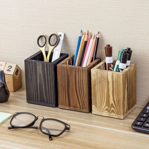 Add stylish storage to your desktop with this set of 3 multi-colored wooden pencil cups with light browndark brown and black stained finishesWith their simple square shape and solid wood constructionthese pencil cups are an excellent way to minimize desk clutter and keep your office supplies stylishly organizedPerfect for organizing penspencils and office stationerythese wooden storage holders can also be used to store paintbrushesmakeup tools and brushesartificial plantscutlery and flatwareand