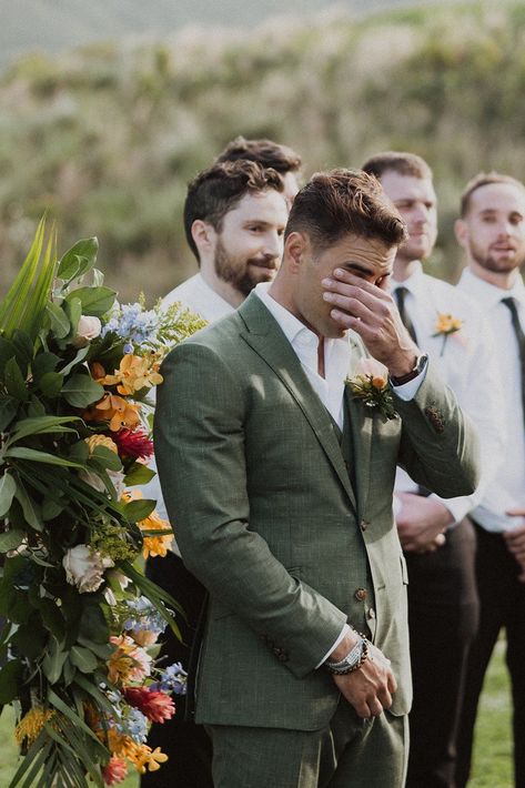 These two had the perfect spring-inspired wedding at Jumanji at Kualoa Ranch! The bride’s two-piece wedding dress was ethereal and romantic, the groom’s suit was the perfect spring sage green tone, and the florals were the perfect assortment of tropical and local flowers. Spring wedding inspiration, Spring wedding floral arrangements, spring mismatched pastel bridesmaids dresses, Hawaii tropical wedding, luxury Hawaii wedding photographer, romantic tropical luxury wedding ceremony inspiration Groom Outfit Garden Wedding, Wedding Groom Green Suit, Garden Groomsmen Attire, Eucalyptus Wedding Groom, Romantic Groom Attire, Garden Party Suit Men, Groom Different Color Than Groomsmen, Green Groom Wedding Party, Mens Green Linen Suit