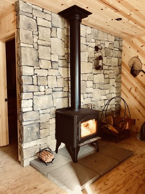 Brick Wall Wood Stove, Rock Wall Behind Wood Stove, Wood Stove Stone Wall, Stone Behind Wood Stove, Wood Stove Back Wall Ideas, Tile Behind Wood Stove, Alaskan Decor, Wood Stove Decor, Free Standing Wood Stove