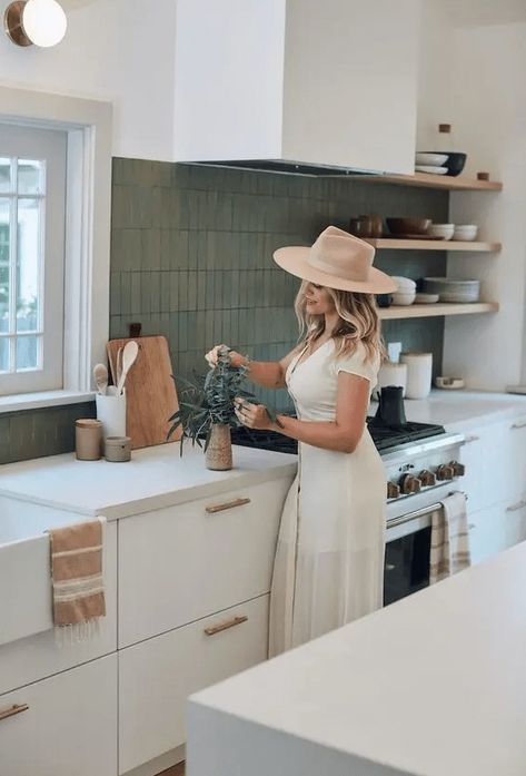 a pretty modern kitchen in white, with white countertops, a matte green stacked tile backsplash and open shelving California Modern Kitchen Design, Kitchen Inside Outside, California Bungalow Kitchen, 70s Kitchen Modern, California Cool Kitchen, California Kitchen Design, California Kitchen Style, California Style Kitchen, California Modern Kitchen