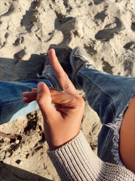 smiley face fine line finger tattoo Inside The Finger Tattoo, Beachy Finger Tattoos, Smiley Finger Tattoo, Sunshine Finger Tattoo, Smile Tattoo Finger, Smiley Face Finger Tattoo, Sun Tattoo Finger, Middle Finger Tattoo, Smiley Tattoo