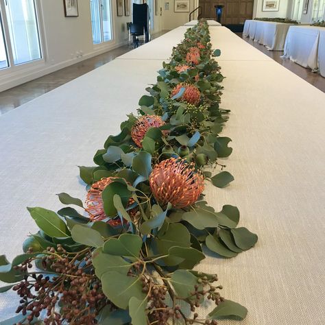 Gum Foliage, Gum Nuts and Leucospermum Table Runner Table Florals, School Dinner, Gum Leaves, School Dinners, Wedding Vision, Long Table, Flower Ideas, Leaf Table, Christmas 2023