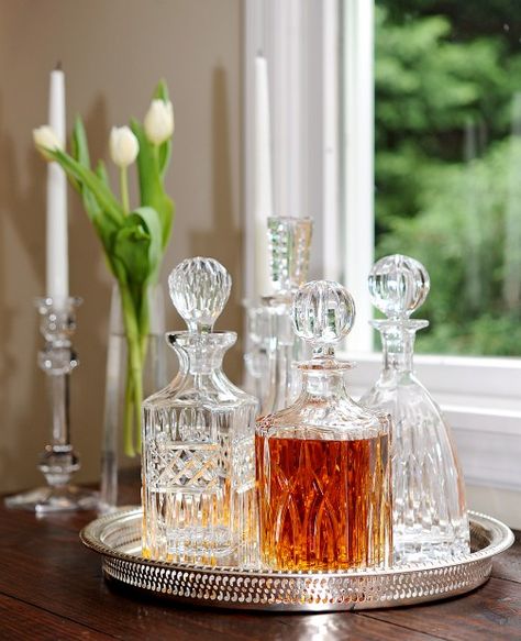 Use those crystal decanters you received for your wedding, put them on a silver tray and set on a rustic farmhouse table for a bit of sparkle! Decanter Display, Bandeja Bar, Gold Bar Cart, Glamour Decor, Rustic Farmhouse Table, Bar Tray, Bar Cart Styling, Drinks Tray, Liquor Decanter