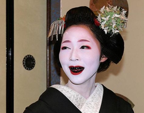 A woman with teeth stained black by the practice of Ohaguro. American Manicure, Black Teeth, Japanese Cosmetics, Tokushima, White Makeup, Japanese Makeup, Stained Teeth, Japanese Geisha, White Face