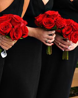 Black dresses, red bouquets! Red Bouquet Wedding Bridesmaid, Simple Rose Bridesmaid Bouquet, Red Bridal Bouquet Rose, Red Bridesmaids Bouquets, Red White And Black Wedding Bouquets, Black Bridesmaid Dresses With Red Roses, Simple Red Rose Bridal Bouquet, Simple Rose Bouquet Wedding, Bridesmaid Rose Bouquet