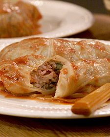 When Martha was growing up in Nutley, New Jersey, her grandmother often made a Polish version of stuffed cabbage leaves called golabki. The filling was a simple one -- rice and meat with onions, garlic, celery, cloves, and green apple -- but the dish was as tasty as it was comforting. Served with a hot tomato sauce and creamy sour cream, it's a perfect meal for the winter season.    Cabbage is often dismissed as too odorous and not particularly tasty. But these problems result from overcooking Galumpki Recipe, Polish Stuffed Cabbage, Martha Stewart Recipes, Stuffed Cabbage, Cooked Cabbage, Smitten Kitchen, Cabbage Rolls, Cabbage Recipes, Menu Ideas