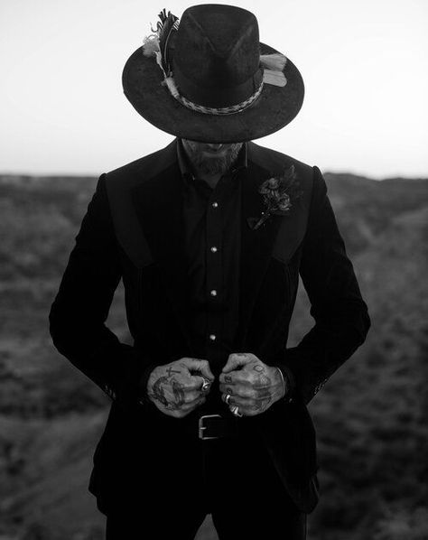 Western dark and moody grooms attire Men Wedding Outfit Cowboy, Gothic Groom Attire, Goth Wedding Guest Outfit Men, Dark Cowboy Wedding, Cowboy Wedding Mens Attire, Cowboy Black Tie Attire, Western Goth Wedding, Cowboy Chic Men, Black Cowboy Wedding