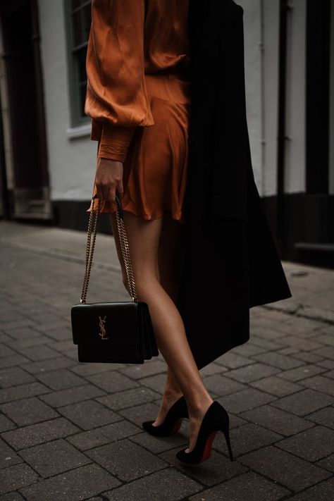 Black YSL Medium Sunset Bag with Orange Zimmermann silk wrap dress and Christian louboutin heels Ysl Sunset Bag Outfit, Ysl Sunset Bag, Ysl Outfit, Tassel Outfit, Ysl Kate, The Revenge, Silk Wrap Dress, Red Bottom Shoes, Saint Laurent Handbags