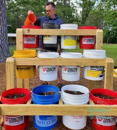 Limited Garden Space? Build a Bucket Planter Stand in One Afternoon Garden Stand Ideas, 5 Gallon Bucket Planter Stand, Five Gallon Bucket Garden Stand, Bucket Planter Stand, Container Garden Stand, Raised Container Garden, Bucket Garden, Tomato Planter, Small House Garden