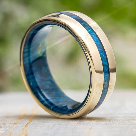 Thisbluemen's wedding band features a colorful, wood inlay up the center and a coordinating layer of the blue wood inside. Crafted in solid gold in your choice of yellow, rose or white and polished to perfection! Keep in mind, thismen's ring can be customized to feature a different wood species, if desired.This ring comes with FREE Ring Armor Waterproofing ($75 value).RING LAYOUT Ring Width: 8mmRing Sleeve: Blue Box Elder Burl Ring Profile: RoundRing Finish: Polished3mm 14K Gold2mm Blue Box Elde Men's Wedding Rings Rose Gold, Gold And Blue Mens Wedding Band, Blue Men’s Wedding Band, Men’s Sapphire Ring, Sapphire Wedding Band Men, Men Engagement Ring For Him, Men’s Engagement Ring, Men’s Engagement Rings, Saphire Wedding Ring