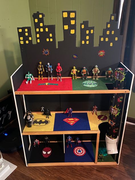 Repurposed Barbie Dreamhouse for boy Boys Dolls House Ideas, Doll House For Boys Diy, Repurposed Dollhouse, Diy Superhero Dollhouse, Super Hero Doll House For Boys, Marvel Dolls House, Boys Dollhouse, Superhero Dollhouse, Superhero House