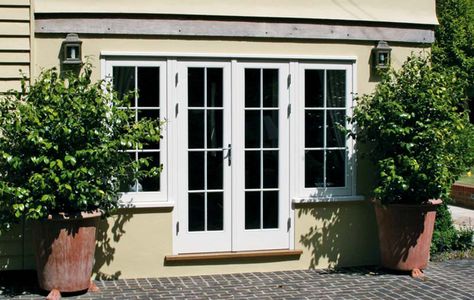 French Doors flanked by casement windows creating light to internal spaces French Doors With Windows, Doors With Windows, French Double Doors, Patio Windows, Timber Windows, French Doors Patio, Casement Windows, Kitchen Doors, House Extensions