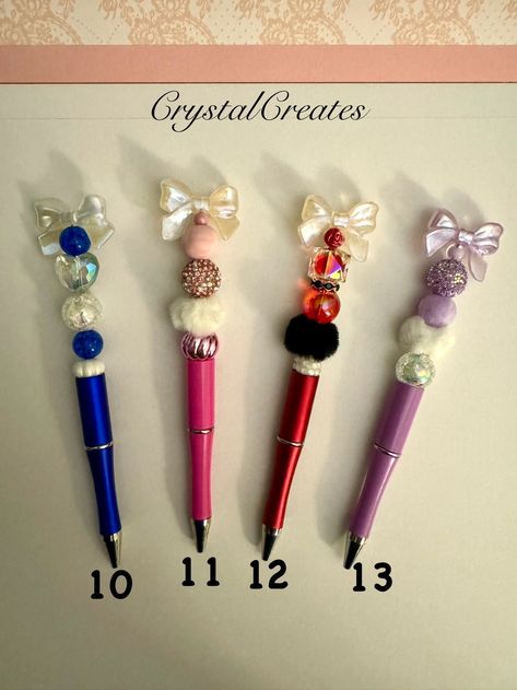 Sweet beaded ballpoint pens with black ink, topped with a bow! These are handcrafted metal and plastic beaded pens. Comes with 2 refills. These make perfect little gifts!  I have many designs and they can be customized to fit your needs. Turnaround time is quick for supply that I have in stock.  The quantities listed for each item is what I have available to ship out immediately.  I can also change color schemes upon request. You can contact me for any questions or customization requests. Beaded Pens, Beadable Products, Diy Hacks, Ballpoint Pens, Craft Materials, Little Gifts, Crafts To Make, Color Change, Color Schemes