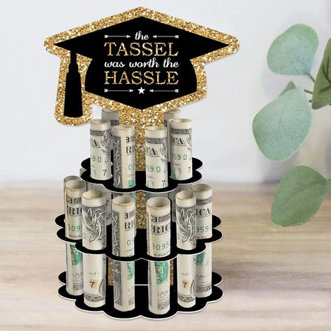 Make every graduation celebration extra special with our Tassel Worth the Hassle - Gold Cash Cake! This unique money cake includes a DIY kit that can hold up to 20 rolled bills. The gold and black design features a grad cap-shaped centerpiece and three layers of varying sizes. Surprise your recipient with a trendy and creative way to gift money. Assembly is easy and the high-quality materials ensure a memorable keepsake. Cash Cake, Diy Grad Cap, Diy Graduation Party, Grad Diy, Graduation Money Gifts, Easy Punch, Gold Graduation Party, Graduation Party Diy, Graduation Money