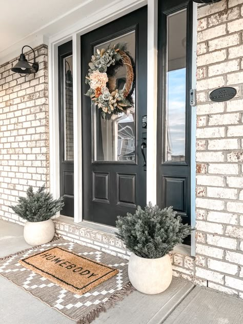 Outdoor Apartment Decor Front Doors, Front Door Decor Double Doors, Fake Front Door Plants, Black Door On Brick House, Townhouse Front Door Decor, Black Front Door Decor Ideas, Outdoor Front Door Decor, Small Front Porch Ideas Curb Appeal Entrance Side Door, Front Door Decor Small Space