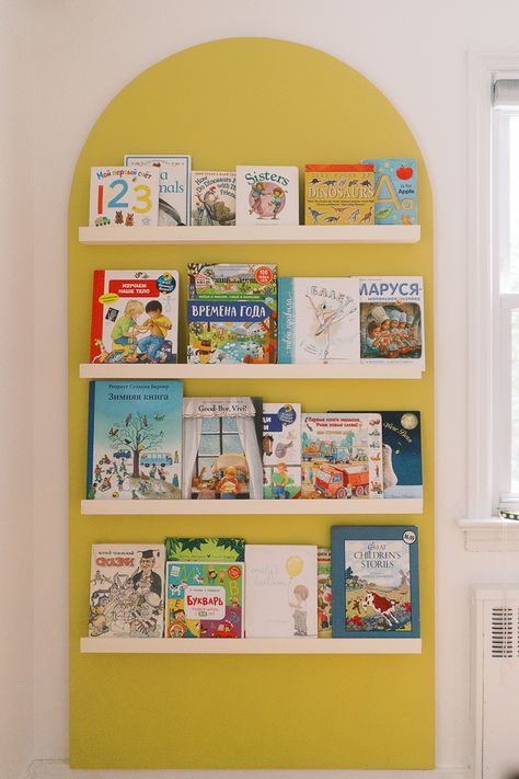 Half Wall Playroom, Book Display On Wall, Book Shelves Ikea, Painted Arch Bookshelf Nursery, Paint Shelf Diy, Ikea Book Display, Painted Arch Shelves, Wall Book Display, Kids Book Storage Wall