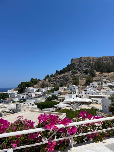 View of Lindos village on the Greek island Rhodes with the view of its cliff top acropolis. Beautiful white town. White washed houses. Lindos Rhodes, Greece Rhodes, Gap Year Travel, Rhodes Island, Sun Aesthetic, Beautiful Cities, Gap Year, Acropolis, Greek Island