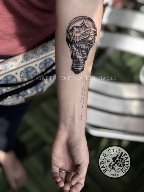 Tattoo celebrating #nepal, #everest, and #diwali. Mountains inside of a lightbulb with prayer flags. #everesttattoo #nepaltattoo #prayerflags #lightbulbtattoo Mt Everest Tattoo, Nepali Tattoo Design, Everest Tattoo, Nepali Tattoo, Nepal Tattoo, Lightbulb Tattoo, Mountain Tattoos, Mt Everest, Tattoo Prices