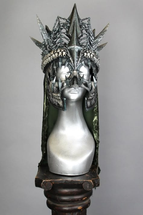 This is a one of a kind piece of wearable art made for the Five and Diamond Seventh Annual Headgear Art Show and shown on August 2, 2019. The riders of the apocalypse are nigh, and Pestilence leads us into the end times. Part ruler, part war general, this headdress gives off serious Nazgul vibes. Designed by Corviid One of a kind Unisex MATERIALS USEDLatex, resin, epoxy, plastic, fabric, EVA foam, acrylic paint. WEARING INSTRUCTIONSBest to hold on crown of teeth. On mask there is wire along the Fabric Mask Design, Eva Foam Mask, Riders Of The Apocalypse, Wearable Art Fashion, Crown Art, The End Times, Plastic Fabric, End Times, The Apocalypse