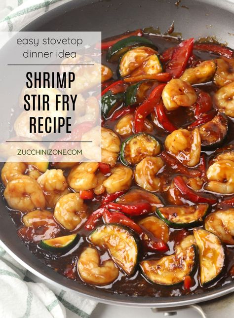 Shrimp stir fry recipe by Zucchini Zone. Shrimp stir fry is a quick and easy dinner recipe that you can have on the table in about 20 minutes! Juicy shrimp, zucchini, and bell pepper are coated in a sweet and savory homemade sauce that's served over steamed rice. #shrimpstirfry #stirfry #20minutemeal #dinnerideas #weeknightmeals Shrimp And Zucchini Stir Fry, Shrimp And Cabbage Stir Fry, Zucchini Shrimp Recipes, Shrimp Zucchini Recipes, Shrimp Stir Fry Recipe, Shrimp And Zucchini, Zucchini Stir Fry, Stir Fry Shrimp Recipes, Shrimp Zucchini