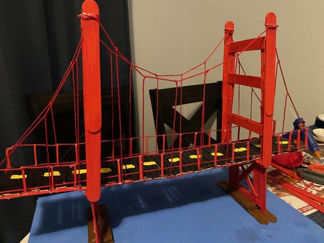 My daughters 4th grade project. We used popsicle sticks, hot glue gun, yarn, and red paint Golden Gate Bridge Project, Treasure School, Popsicle Bridge, Stem Bridges, Popsicle Stick Bridges, Popsicle House, Science Exhibition Projects, Bridge Ideas, Bridge Project