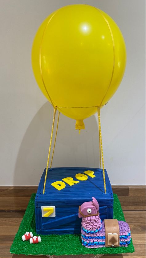 Fortnite drop box cake with balloon and loot piñata Fortnite Drop Box Cake, Fortnite Pinata, Box Birthday Cake, Minecraft Birthday Ideas, Fortnite Party Ideas, Drop Cake, Fort Nite, Boys Birthday Cakes, Fortnite Cake