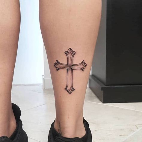 silhouette of a cross tattooed on the back of the leg of woman wearing black sneakers tattoos that mean strength Cross On Leg Tattoo, Cross Leg Tattoo, Louise Tattoo, T1d Tattoo, Cool Cross Tattoos, Cross Tattoo Ideas, Unique Cross Tattoos, Small Cross Tattoos, Tattoo Son