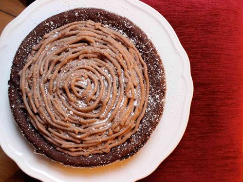 This rich and luxurious flourless chestnut-and-chocolate torte is flavored with bourbon and topped with a swirl of sweetened chestnut purée. It's the perfect end to a wintertime holiday meal. Chestnut Puree Recipe, Chestnut Puree, Homemade Hot Chocolate Mix, Skillet Chocolate Chip Cookie, Torte Recipe, Chocolate Torte, Chocolate Cream Pie, Malted Milk, Homemade Hot Chocolate