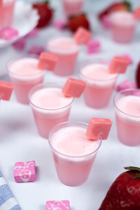 These Starburst Jello shots are a delicious and creamy strawberry Jello shot with the flavor of everyone’s favorite chewy fruit candies. Easy to make and perfect for parties, these are a fun and delicious twist on the classic Jello shot. Pastel Jello Shots, Cute Party Appetizers, Jello Shot Charcuterie Board, Strong Jello Shots, Virgin Jello Shots, Pink Jello Shots, Strong Jello Shots Recipe, Fancy Jello Shots, Starburst Shots