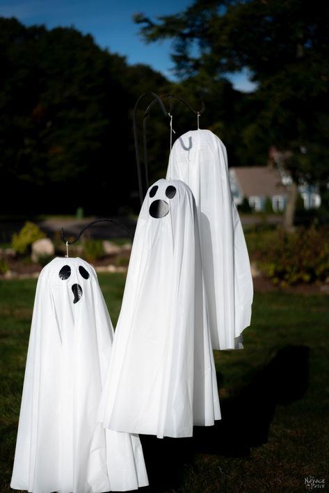 Easy Lighted Hanging Ghosts (A Dollar Store DIY) | DIY lighted hanging yard ghosts - rainproof | Repurposed plastic table cloths | Upcycled Dollar Store paper lanterns | How to make a life size hanging ghost with lights | DIY life-size Halloween prop | #TheNavagePatch #Upcycled #easydiy #DIY #Halloweendecor #DollarStore #HowTo #Halloween #Repurposed #DollarTree #ghost | TheNavagePatch.com Dollar Store Halloween Diy, Outdoor Ghosts, Diy Halloween Ghosts, Halloween Outside, Easy Diy Halloween Decorations, Halloween Ghost Decorations, Ghost Diy, Hanging Ghosts, Dollar Store Halloween