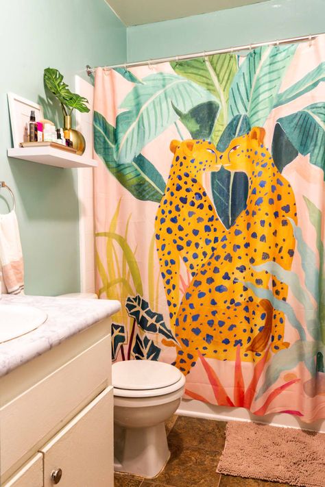 The shower curtain is from <a href="https://society6.com/product/p1487310_shower-curtain?sku=s6-9549808p34a35v287&utm_source=Pinterest&utm_medium=Social" target="_blank" rel="noreferrer noopener">Society6</a>. Credit: <a href="https://www.apartmenttherapy.com/authors/marisa-vitale">Marisa Vitale</a> Los Angeles Apartment, Bathroom Rental, La Apartment, Colorful Bathroom, Rental Bathroom, Los Angeles Apartments, Grey Accent Wall, Pom Pom Pillows, Colorful Bohemian