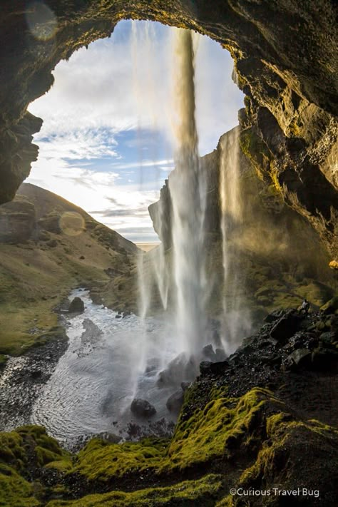 The view from behind the waterfall in Iceland. Kvernufoss is a great waterfall to visit on the south coast of Iceland just off the Ring Road. Behind The Waterfall, South Coast Iceland, Iceland Aesthetic, Iceland Resorts, Iceland Honeymoon, Hidden Waterfall, Iceland Nature, Iceland Vacation, Travel Iceland