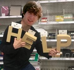 guy holding help letter signs meme h e l p cursed image reaction photo