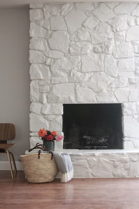 34 Beautiful Stone Fireplaces That Rock Use a primer and paint combo along with a paintbrush and a roller to update this beautiful feature.{found on joysofhome}. Painted Rock Fireplaces, Painted Stone Fireplace, Stone Fireplace Makeover, Design Camino, Simple Fireplace, Fireplace Redo, Greige Design, Fireplace Update, Masonry Fireplace