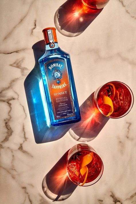 Bold and iconic, the Sunset Negroni is ideal for when day descends into night. Sunset Martini, Beverage Photography, Bombay Sapphire, Cocktail Photography, Orange Twist, London Dry Gin, Star Anise, Dry Gin, Gin Cocktails