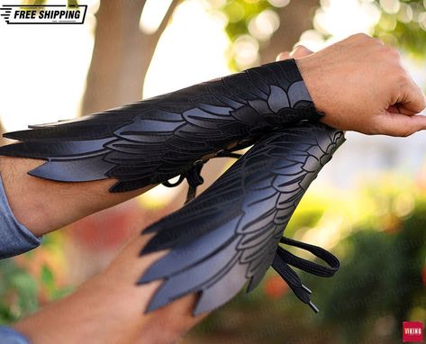 Samurai Knight Leather Arm Warmers, Raven Wings Viking Larp Armor, Ren Faire Medieval Cosplay Armor, Vintage Pirate Elf Warrior Braces Armor Embrace Viking style with these medieval raven wings leather arm warmers, exuding authenticity and a fierce Norse aesthetic to elevate your attire. Perfect for adding a bold and distinctive touch to your outfit, these arm warmers embody the spirit of Viking heritage with their unique design. Product Factors: Gender: Unisex Material: Leather Type: Medieval armor Characters: Knight Special Use: Costumes Source Type: Historical Item Type: Accessories Processing Time: 1-3 Business Days Kindly allow 1-3 business days for us to meticulously prepare your order before shipment. Shipping Duration by Location * United States: Customers can anticipate their pack Norse Aesthetic, Rogue Outfit, Samurai Knight, Larp Outfit, Viking Heritage, Medieval Accessories, Vintage Pirate, Ren Faire Outfits, Raven Wings