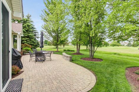 Paver Patio Ideas (Design Guide) - Designing Idea Curved Patio Ideas Backyard Designs, Paver Patio Front Yard, Curved Paver Patio, Rectangular Patio Ideas, Outdoor Paver Patio Ideas Backyards, Curved Concrete Patio Ideas, Paver Patio Border Ideas, Cobble Stone Patio Ideas, Classic Patio Design