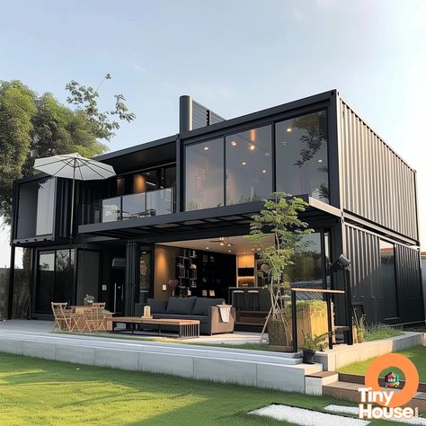 Check out this amazing shipping container house in a sleek and modern design! The combination of white, gray, black, and metallic colors creates a stunning visual appeal. Get inspired for your own container house project! Share with us what you're planning to build! #containerhouse #designinspiration #tinyhome Container Home Ideas Design, Industrial Container Home, Container Mansion Homes, Loft Container Homes, Container House With Garage, Big Container House, House Container Ideas, Black Container Home, Large Container Homes