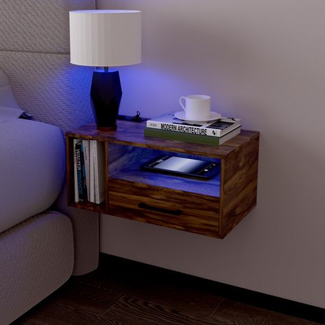 PRICES MAY VARY. NIGHTSTAND WITH LED LIGHTS: The dreamy floating Nightstands Lighting Designs(16 Static Colors,4 Dynamic Modes) brightness can be adjusted,you will always find your favorite light to raise bedroom vibes. It will create a fantastic ambiance in your bedroom in the dark. CONVENIENT CHARGING: The bedside table is equipped with 2 USB ports and 1 AC outlets, making it a breeze to charge your phone, electronics equipment. Concealed wire design prevents cable clutter. A set is always bet Floating Nightstand Drawer, Raised Bedroom, Floating Nightstands, Mens Bedroom Decor, Floating Bedside Table, Masculine Interior, Bedroom Vibes, Nightstand With Charging Station, Bedside Night Stands