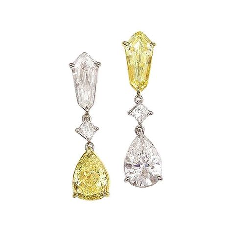 (DiamondTown) These stunning dangle earrings each contain one kite shape and one pear shape diamond, linked by a princess cut diamond. The left and right legs are mirror image in the yellow-white pattern. Kite shape diamonds are 0.96 (Yellow) and 0.86 (White) Pear shape diamonds are GIA Certified 1.81 carat Fancy Yellow SI1; GIA Certified 1.51 carat F/SI2 2 Princess cut diamonds are 0.26 carats. Total diamond weight 5.40 carats. Set in 18k White and Yellow Gold. Many of our items have matching c Pink Diamond Earrings, Diamond Shape Earrings, Earrings Dangling, Types Of Earrings, Diamond Dangle Earrings, Fancy Diamonds, Pear Shaped Diamond, Antique Earrings, Diamond Drops