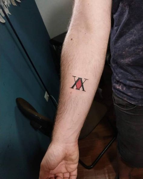 Anime Tattoos For Men Ideas, Anime Wrist Tattoos Men, Scout Regiment Tattoo, Hxh Minimalist Tattoo, Hxh Inspired Tattoos, Tattoo Ideas Hunter X Hunter, Simple Hxh Tattoo, Men Anime Tattoo Ideas, Hunter X Hunter Tattoo Killua