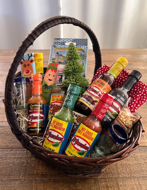 This holiday season, give the gift that will ignite their taste buds and spice up their festivities! This HOT holiday gift basket is a flavor-packed extravaganza, complete with Yucateco Hot Sauces. Choose from El Yucateco’s 13 different flavors of hot sauces. Including 6 new sauces released in 2023! El Yucateco is the #1 habanero hot sauce in the U.S. and ranks in the top 10 of all sauces sold in the U.S. El Yucateco is EVERYONE’S hot sauce and this gift will make someone extra happy this holiday season. https://www.shopelyucateco.com/ #ad #ElYucateco #KingofFlavor #HotsauceHoliday @elyucateco_hotsauce Hot Sauce Gift Basket Ideas, Hot Sauce Gift Basket, Spicy Popcorn, Sipping Tequila, Holiday Gift Basket, Unique Snacks, Habanero Hot Sauce, Holiday Gift Baskets, Hot Sauces