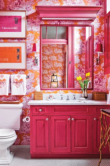 Designing for someone who likes bright colors? This bathroom would be perfect for them! If it's a bit much, use less color, such as on the molding around the lights, the mirror frame, and the edges of the cabinet doors! Deco Orange, Orange Bathrooms, Toile Wallpaper, Eclectic Bathroom, Trending Paint Colors, Bathroom Color Schemes, Stunning Bathrooms, Bathroom Color, Girls Bathroom