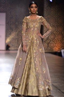 Rimple and Harpreet Narula runway couture 2016 collection online. a beige collared off-shoulder tulle jacket with tonal gold birds and floral motifs appliqued in kasab and gota work all over. Shop this now at www.carmaonlineshop.com #ICW2016 #carmaonlineshop #indian #designer #Rimple&Harpreet #ethnic #heritage #India #craft #lehenga #wedding #sequin #zardozi #embroidery #whimsical #shimmer #couture #shopnow #shoponline Off Shoulder Anarkali, Anarkali Jacket, Anarkali Bridal, Rimple And Harpreet Narula, Beautiful Bridal Dresses, Latest Designer Dresses, Bollywood Dress, Gaun Fashion, Gota Work